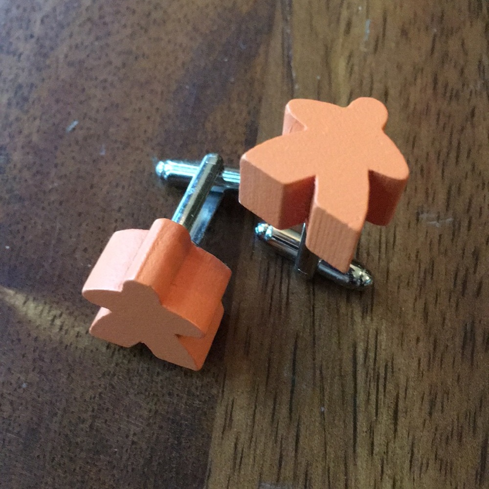 Orange meeple cufflinks